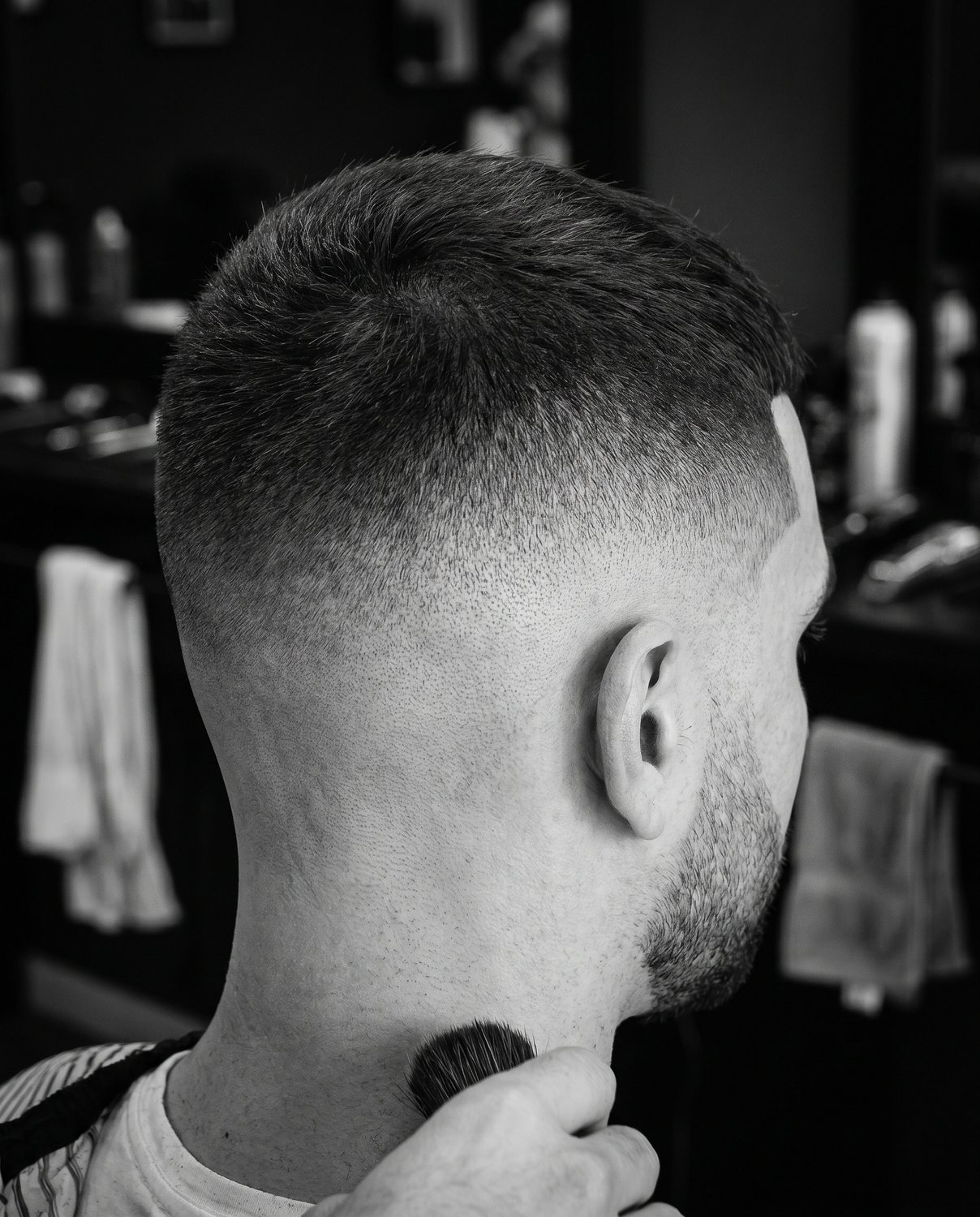 A precise skin fade, sharp back-of-head detail