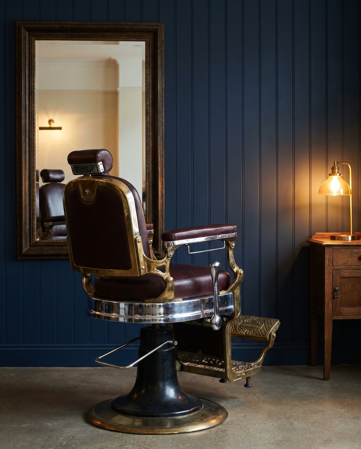 An antique porcelain and leather barber chair