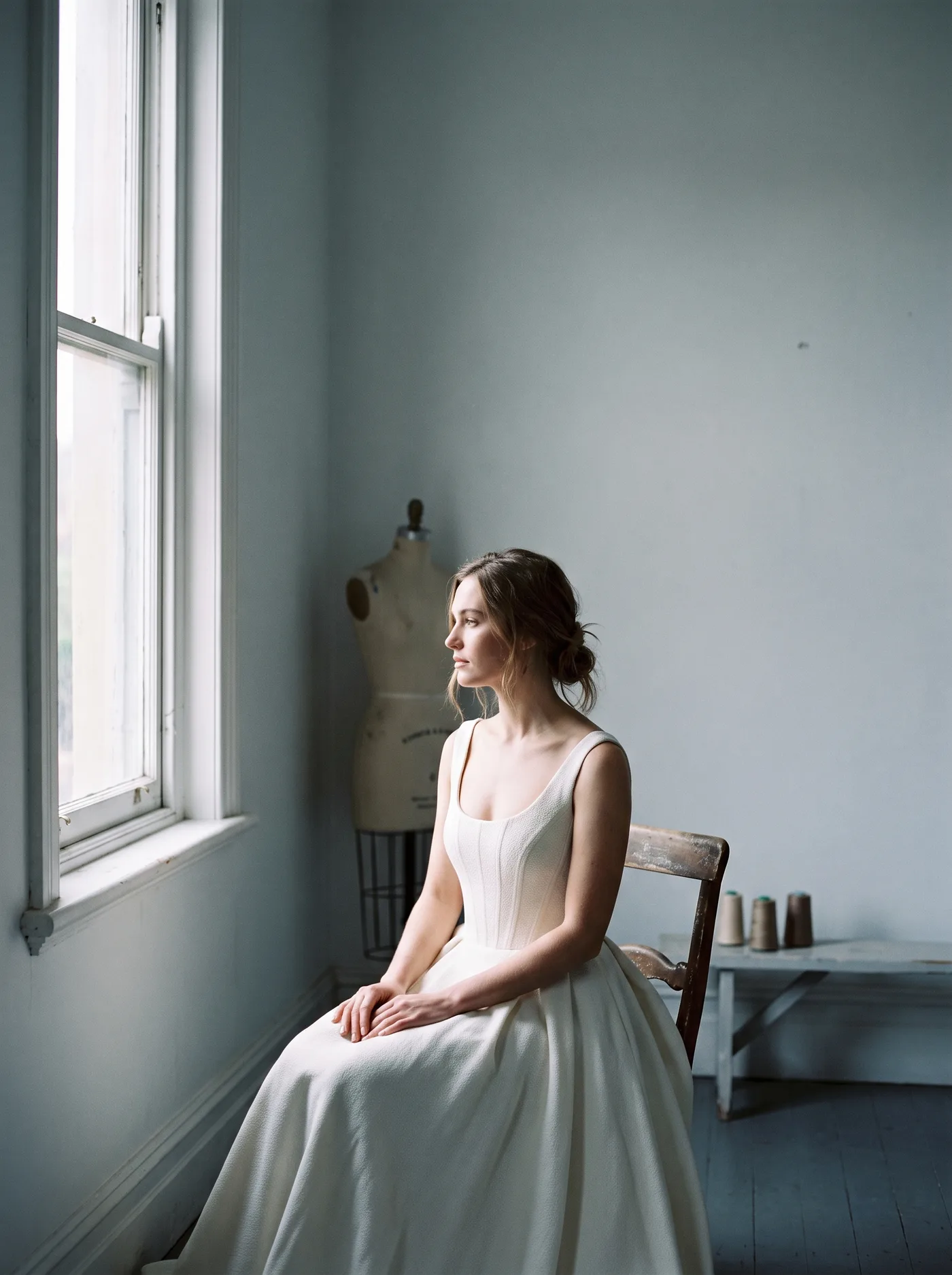 Look 03, a structured bodice photographed seated in window light.
