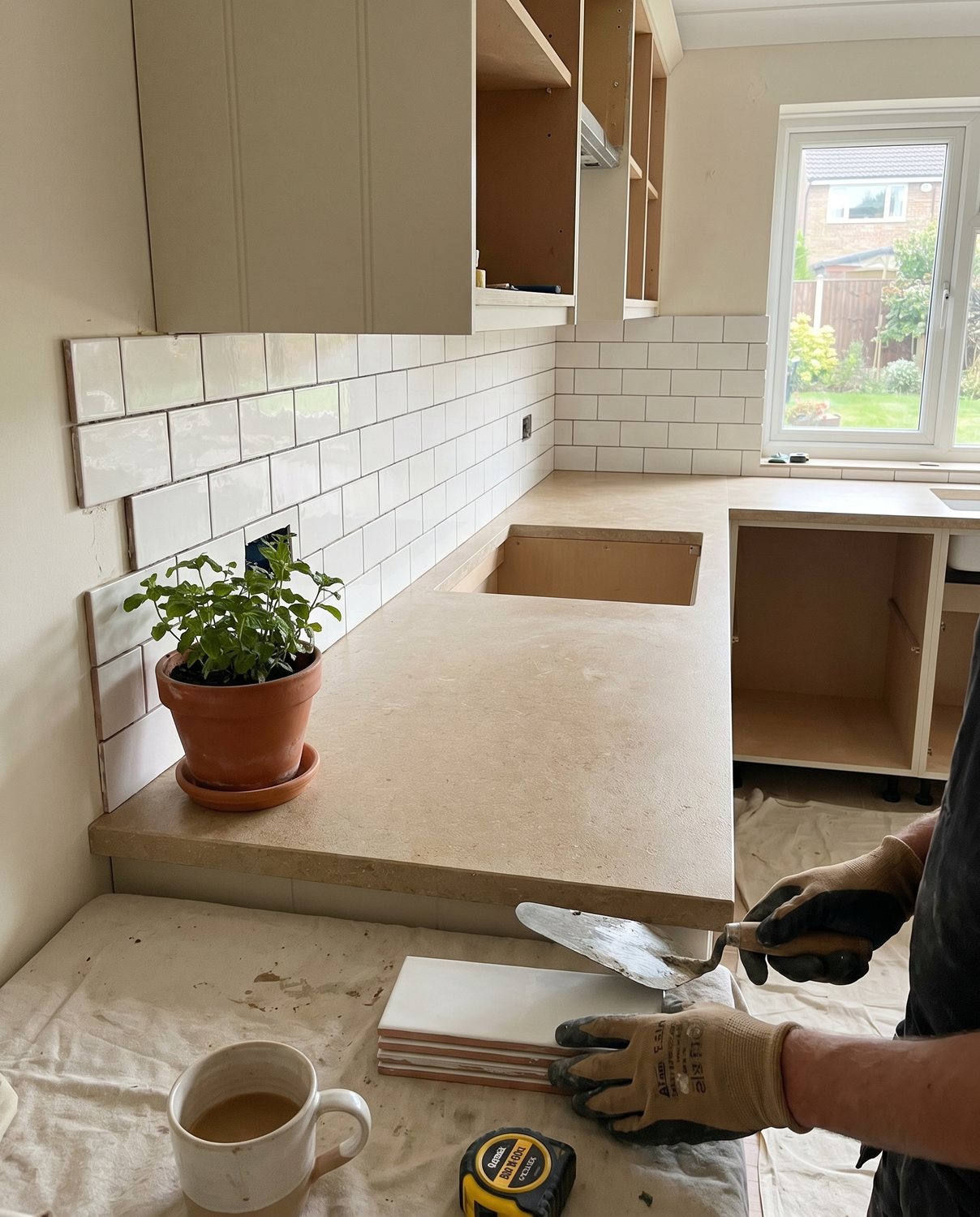 A clean kitchen splashback in subway tile
