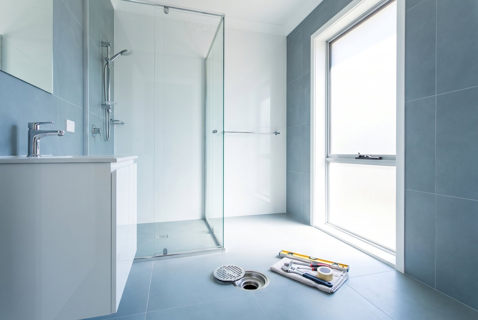 A clean, modern bathroom after drainage work